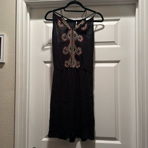 Be cool black dress with colorful details. Size L.